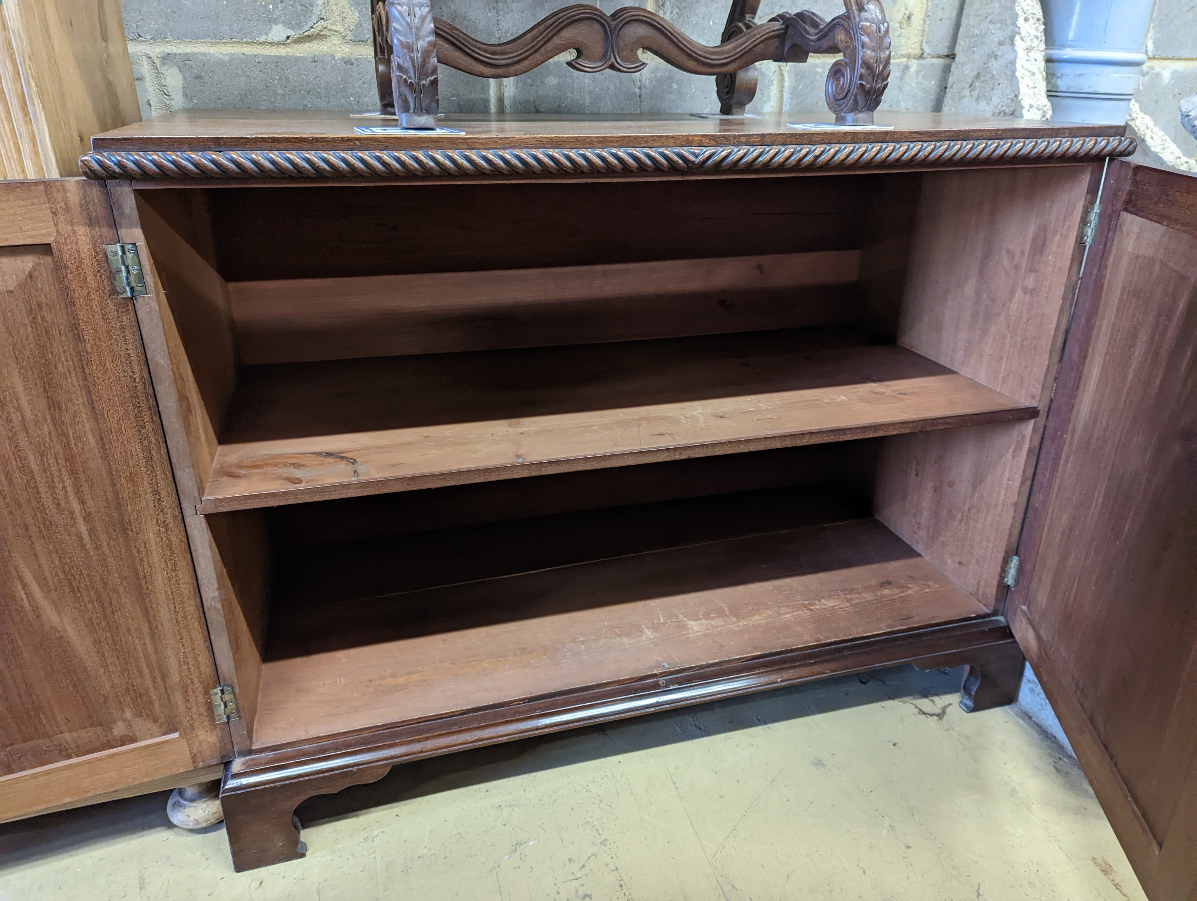 A mahogany two door side cabinet, width 110cm, depth 51cm, height 84cm